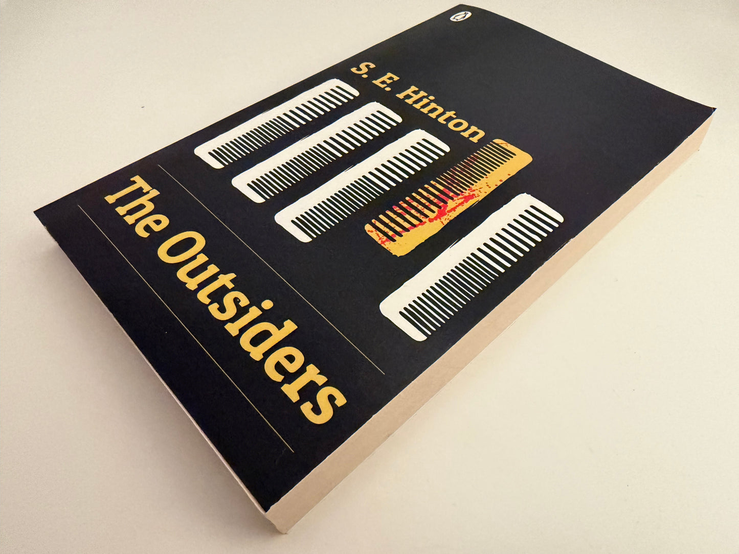 The Outsiders by S. E. Hinton (paperback book)