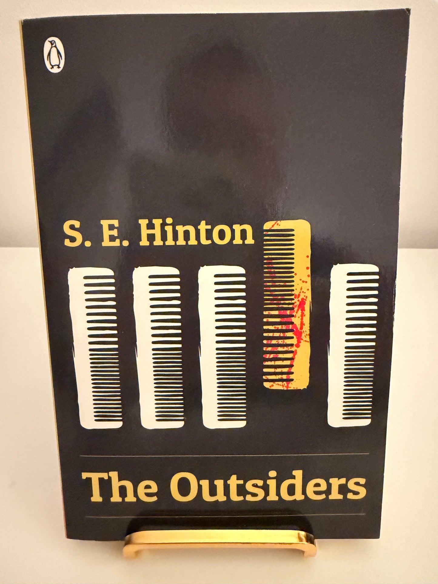 The Outsiders by S. E. Hinton (paperback book)