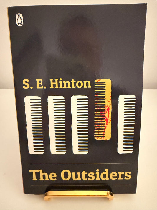 The Outsiders by S. E. Hinton (paperback book)