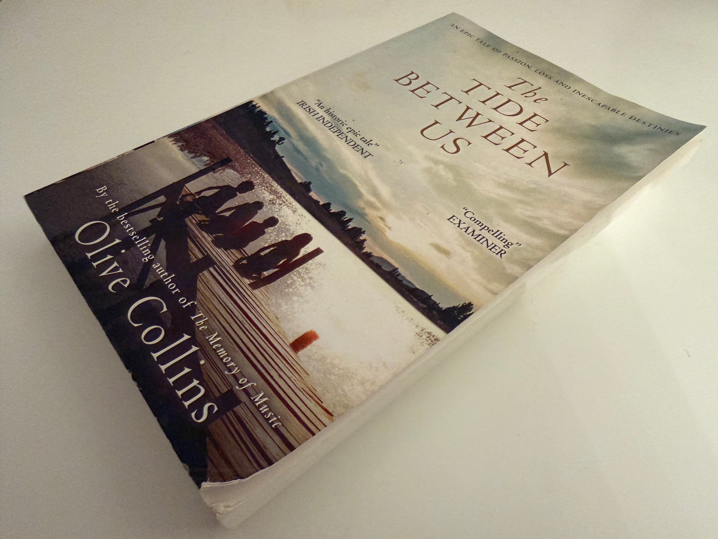The Tide Between Us by Olive Collins (paperback book)