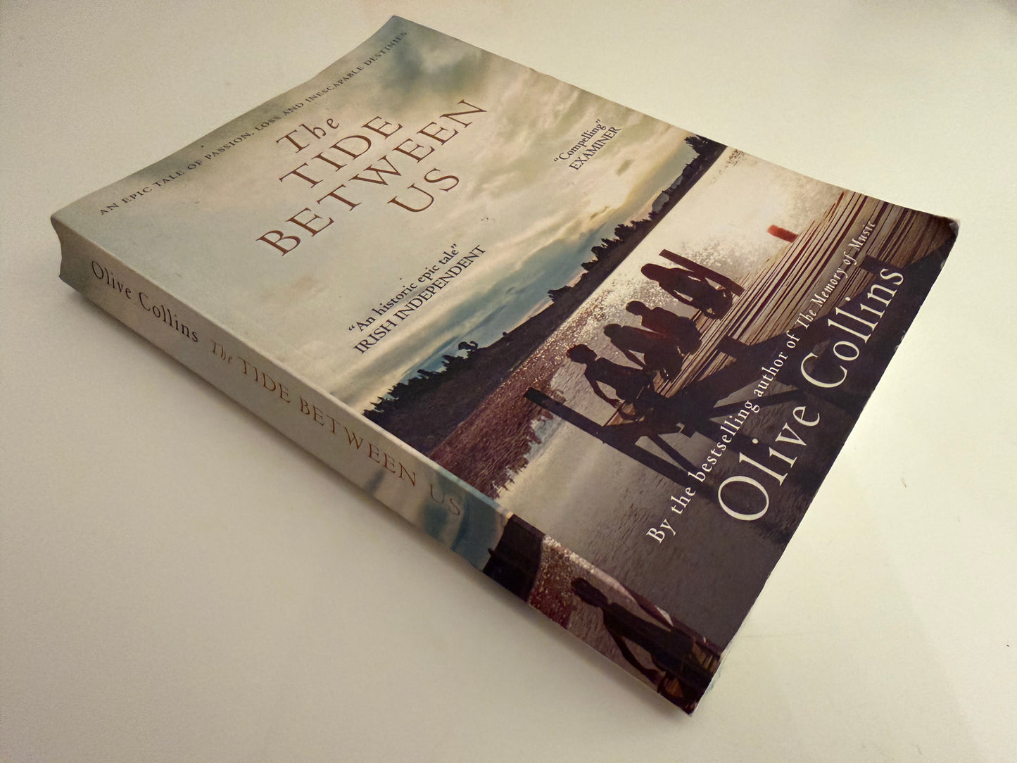 The Tide Between Us by Olive Collins (paperback book)